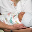 Grandma Lynn holding baby Ellison while still in the hospital.